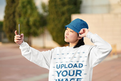 Sweatshirt Mockup of a Serious Woman Posing for a Selfie m34229 r-el2