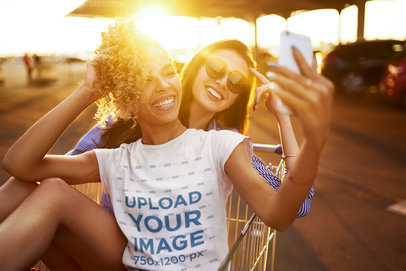 T-Shirt Mockup of a  Happy Woman Taking a Selfie With a Friend