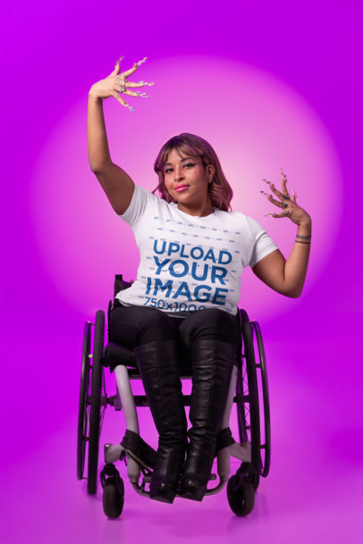 LGBT Voguing-Themed Mockup of a Woman Wearing a Bella Canvas Tee and Using a Wheelchair  m34184