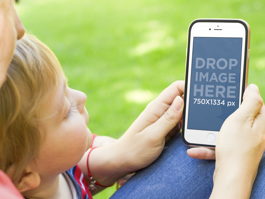 Mockup of a Boy Looking at Her Mom's iPhone