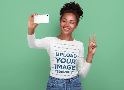 Mockup of a Woman Taking a Selfie in a Long Sleeve T-Shirt
