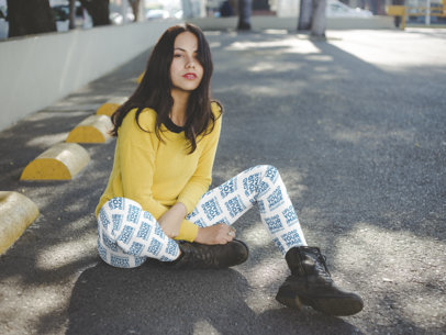 Mockup of a Woman Wearing Leggings Sitting on the Floor at a Parking Lot