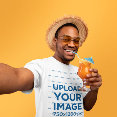 Selfie-Themed Mockup of a Man Wearing a T-Shirt While Drinking an Exotic Cocktail