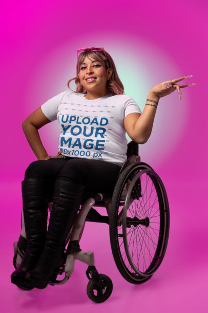 Bella Canvas T-Shirt Mockup Featuring a Smiling Woman on a Wheelchair Doing a Vogue-Inspired Pose m34186