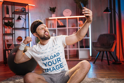 Selfie-Themed Mockup Featuring a Fitness Man With a T-Shirt Taking a Photo