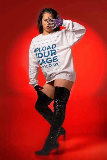Gildan Sweatshirt Mockup Featuring a Woman With High Boots and Doing a Vogue-Inspired Pose