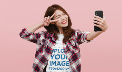 Crewneck Tee Mockup of a Woman Taking a Selfie and Winking Her Eye