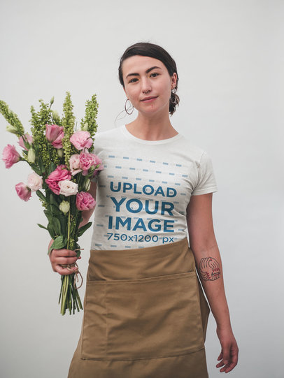 T-Shirt Mockup of a Woman Holding a Flower Bouquet