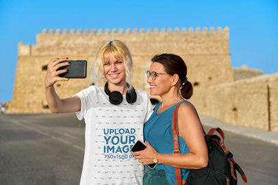 Round-Neck Tee Mockup of a Young Woman Taking a Selfie with Her Mom