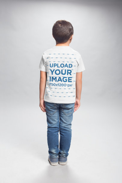 T-Shirt Back Shot Mockup of a Kid Standing in a Photo Studio
