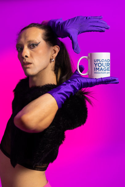 Mockup of a Woman Holding a Coffee Mug Featuring a Vogue-Inspired Theme