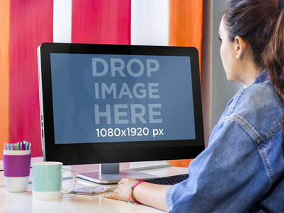 Dell PC Mockup Featuring a Young Woman at a Creative Office