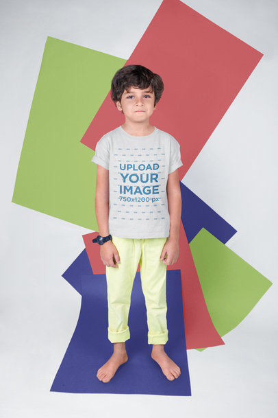 T-Shirt Mockup of a Serious Kid with a Colorful Background
