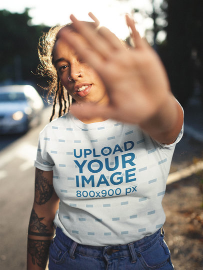 T-Shirt Mockup Featuring an Edgy Model Posing at the Street a19758