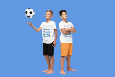 T-Shirt Mockup Featuring Two Smiling Boys Posing in a Studio With a Soccer Ball