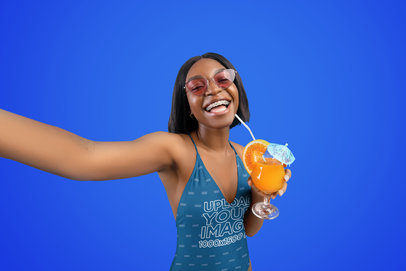 Swimsuit Mockup of a Smiling Woman Taking a Selfie with a Summer Cocktail