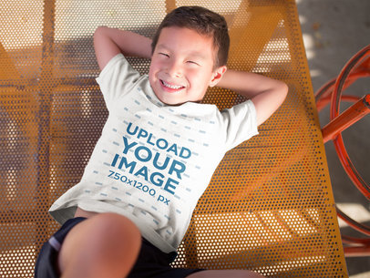 T-Shirt Mockup of a Happy Asian Kid in a Playground