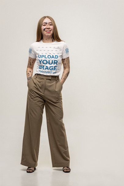 Bella Canvas Round-Neck T-Shirt Mockup of a Cheerful Woman Posing in a Studio