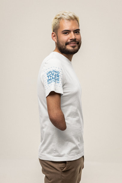 Mockup of a Man Posing in a Bella Canvas T-Shirt with a Customizable Sleeve