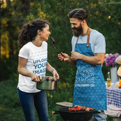 Apron and Heathered T-Shirt Mockup of a Happy Couple Celebrating Canada Day