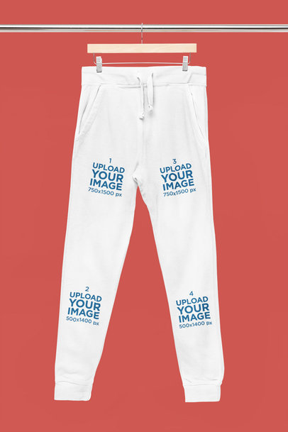 Mockup of a Pair of Sweatpants Hanging From a Steel m33404