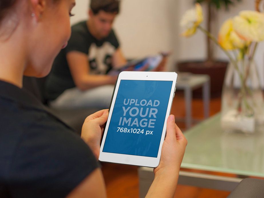 iPad Mini Mockup Featuring a Woman in a Waiting Room