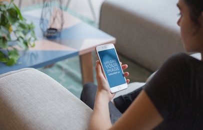 Pink iPhone 8 Plus Mockup of a Girl Relaxing in a Living Room 21268a