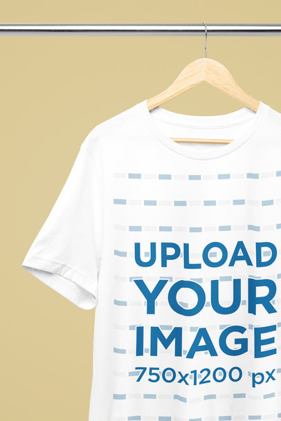 Mockup of a Bella Canvas T-Shirt Hanging From a Steel