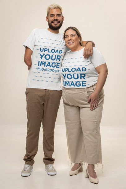 Bella Canvas T-Shirt Mockup of a Bearded Man and a Woman Posing in a Studio With a Smile