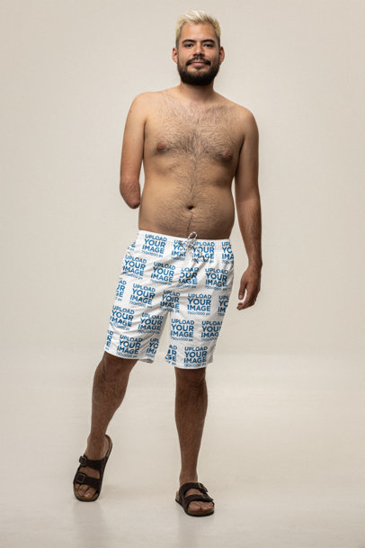 Swim Trunks Mockup Featuring a Bearded Man Posing in a Studio