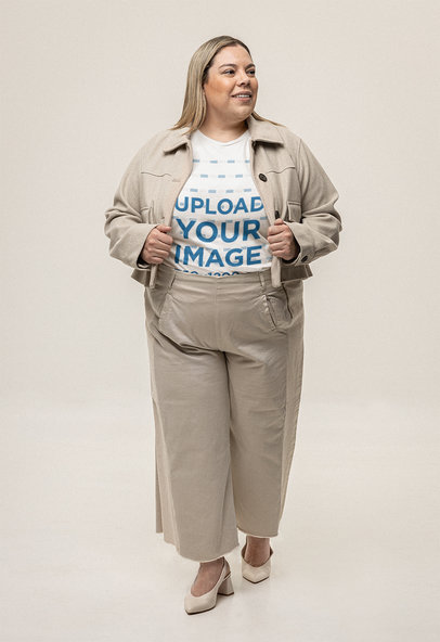 Mockup Featuring a Woman Wearing a Plus Size Bella Canvas Tee in a Studio