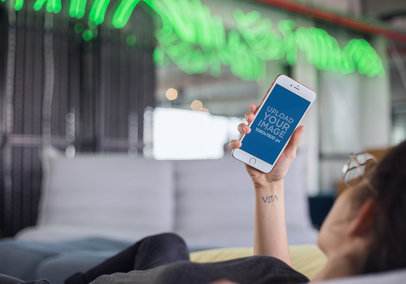 Rose Gold iPhone 7 Plus Mockup of a Woman with Glasses Using her Cellphone