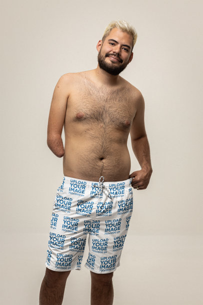 Swim Trunks Mockup of a Bearded Man Posing in a Studio