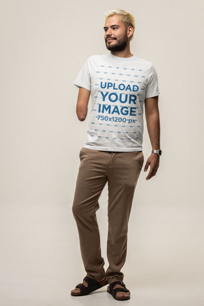 Bella Canvas Tee Mockup of a Man with Dyed Hair Standing in a Studio