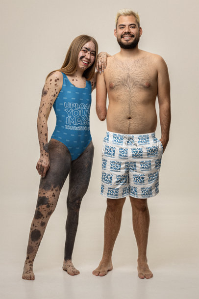Swimsuit and Swimtrunks Mockup Featuring Two Friends Posing Together in a Studio