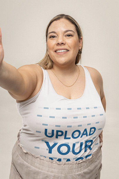 Mockup of a Woman Taking a Selfie of Herself in a Plus Size Tank Top