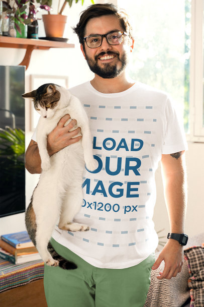 Bella Canvas T-Shirt Mockup Featuring a Smiling Bearded Man Holding a Kitty