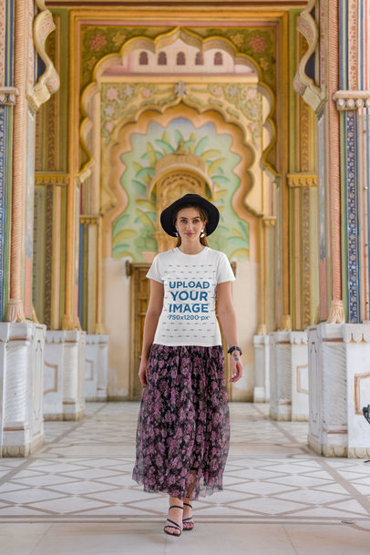 Round-Neck Gildan T-Shirt Mockup of a Woman Walking Inside an Ancient Temple