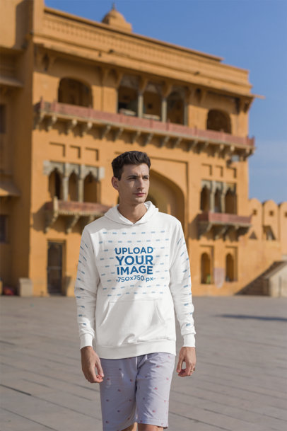 Gildan Hoodie Mockup of a Traveler Man Walking by the Street