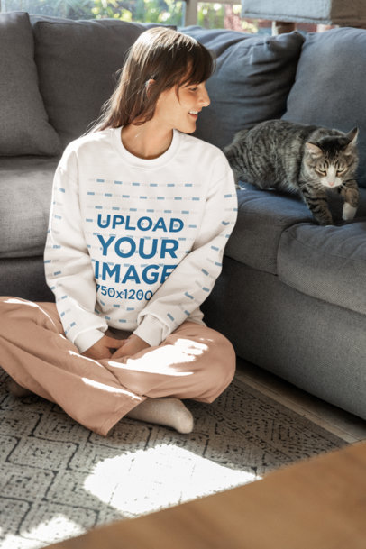 Gildan Crewneck Sweatshirt Mockup Featuring a Woman Playing With a Cat