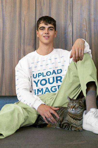Gildan Sweatshirt Mockup of a Smiling Man Posing with His Cat