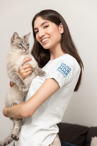 Bella Canvas T-Shirt Mockup of a Happy Woman Holding Her Kitten 