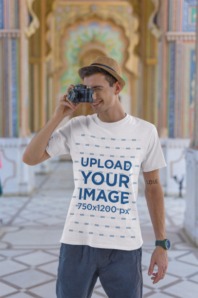 Gildan T-Shirt Mockup of a Man Taking a Picture with His Camera 
