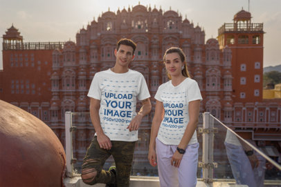 Gildan T-Shirt Mockup Featuring a Happy Couple Posing Against a Balcony and a Big Building m34651