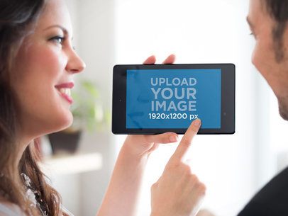 Mockup Featuring a Couple Using a Nexus 7 in Landscape 