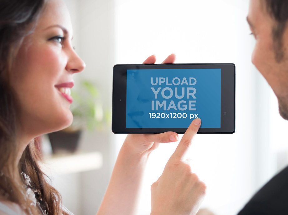 Mockup Featuring a Couple Using a Nexus 7 in Landscape 