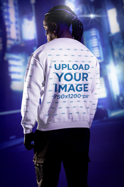 Back-View Sweatshirt Mockup of a Man in a Cyberpunk-Themed Setting