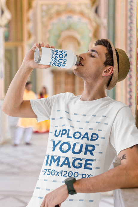 Gildan T-Shirt Mockup Featuring a Man Drinking From an Aluminum Bottle