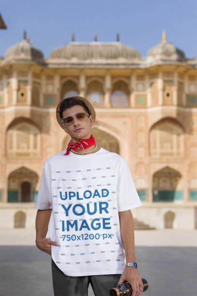 Round-Neck T-Shirt Mockup of a Traveler Man Posing Against a Historical Place
