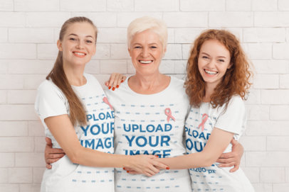 Cancer Awareness-Themed Mockup of Three Women Wearing Ribbons Hugging Each Other